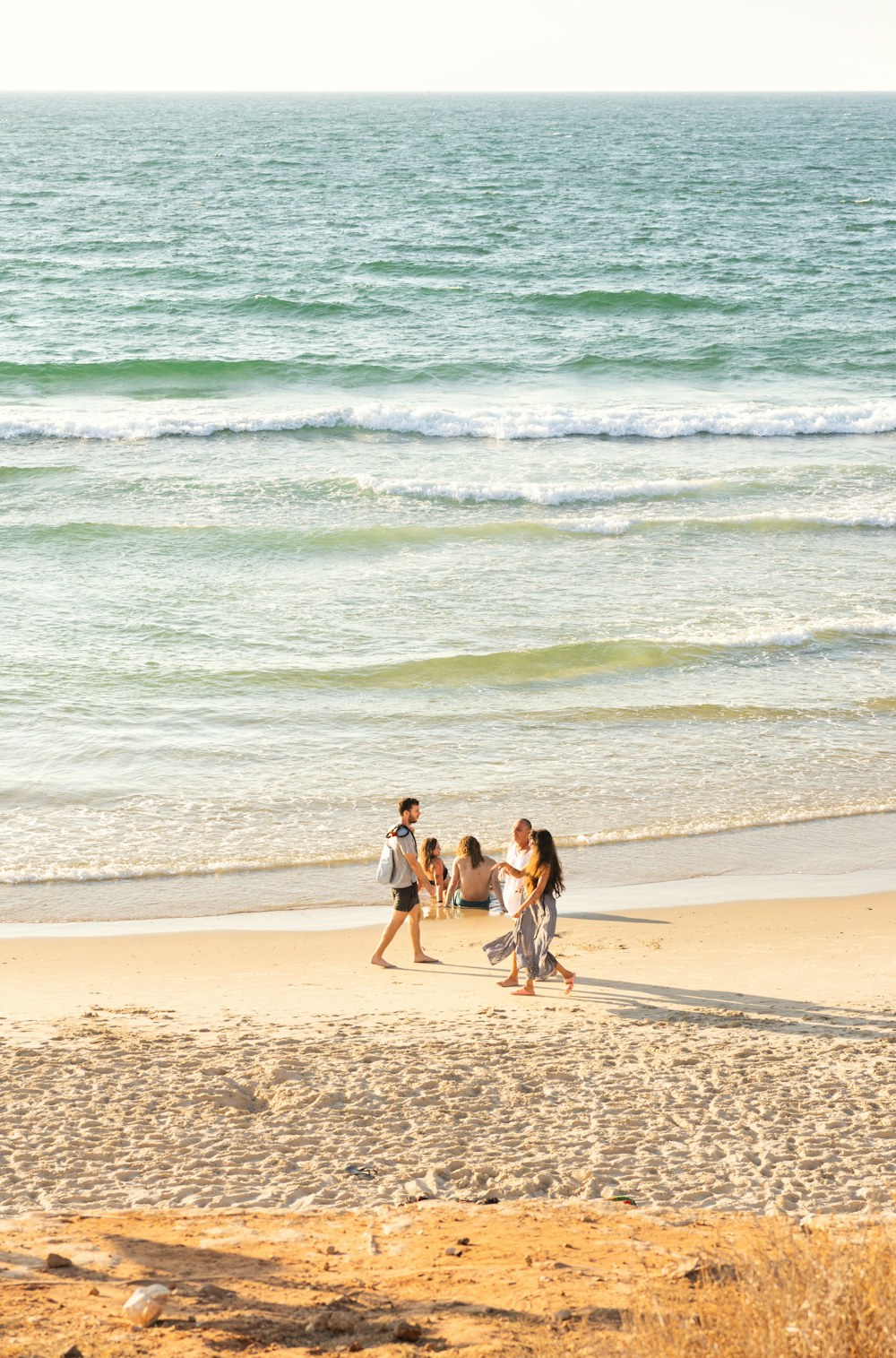 People enjoying an evening at the coast